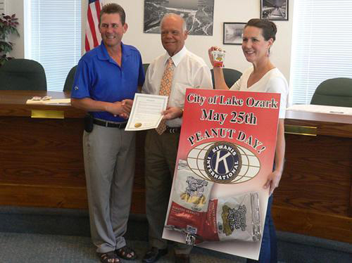 Mike as President of the Ozark Coast Kiwanis club accepting a proclamation from Lake Ozark Mayor, Johnnie Franzeskos recognizing Kiwanis efforts for 